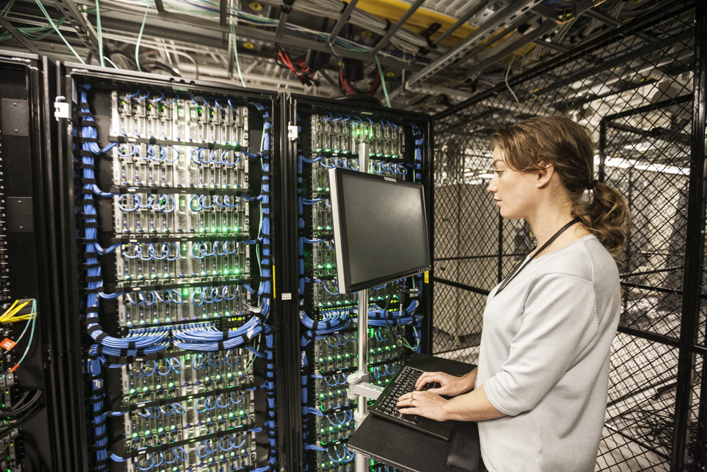 Technology experts in Portland's local it support companies A female technology expert fixing a server in Portland Oregon